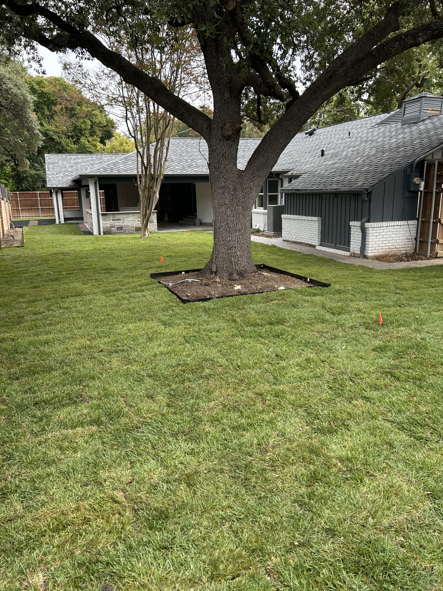 Completed artificial turf lawn with clean edge detail