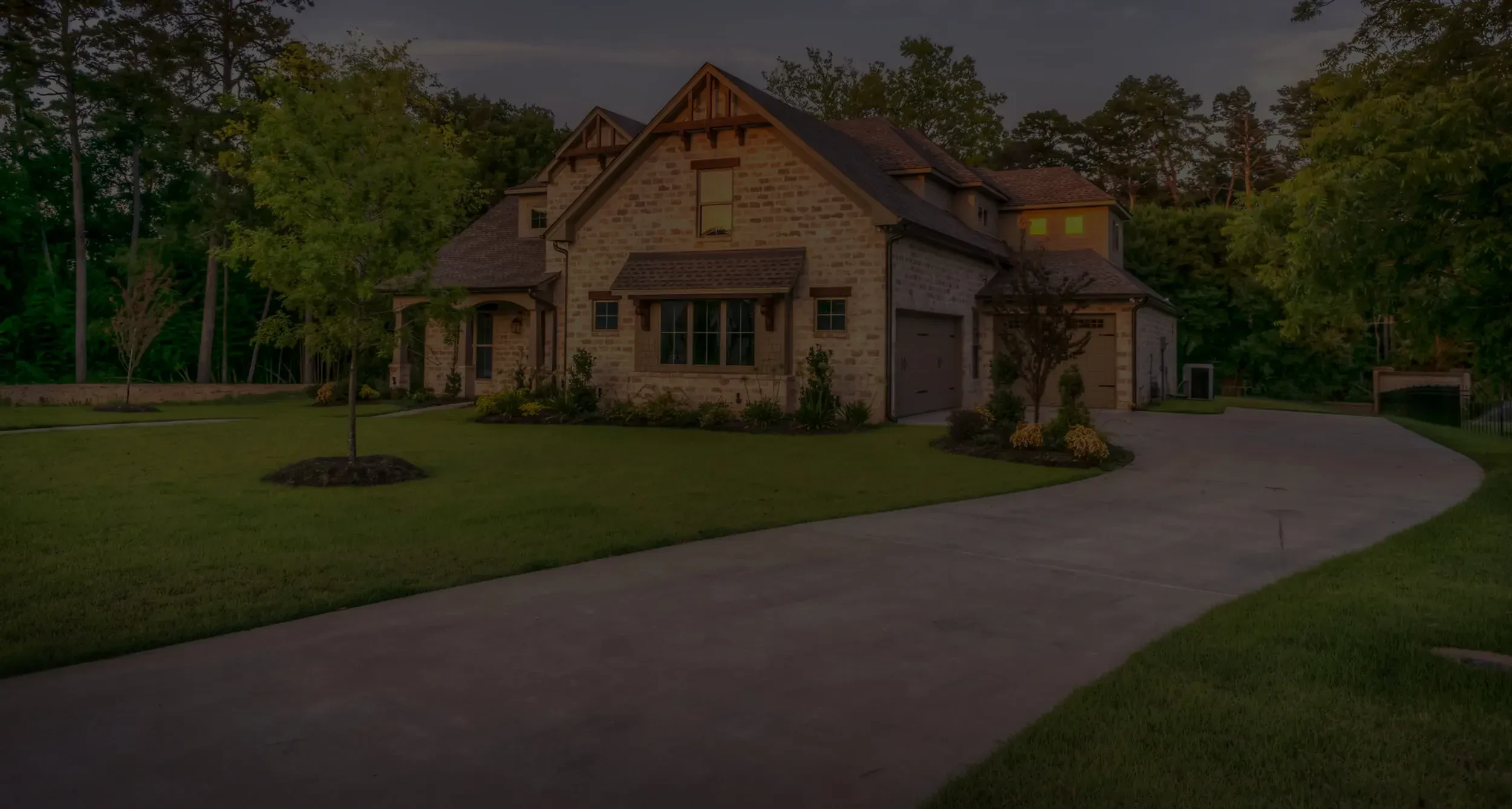 Completed residential landscape with fresh sod and chopped stone bed edging in North Texas